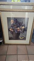 Framed floral and fruit still life picture with beige/gold frame and double matting.