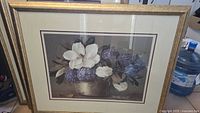 Flower picture frame with white and purple flowers in metallic bowl, gold frame