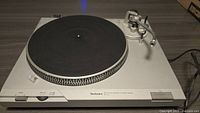 Top view of Technics SL-D2 turntable showing platter, tonearm, and base.