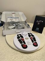 Full view of the Dr. Ho Circulation Promoter package showing foot platform and box with accessories.