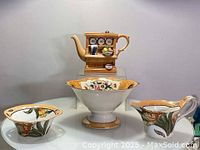 Four-piece tea set with 3D hand painted England teapot, cream set, and Noritake candy stand