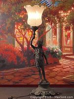 Front view of the full lamp, lit to show overall design and height