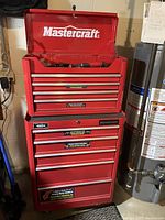 Front view of red Mastercraft two-piece tool chest with top and bottom units stacked