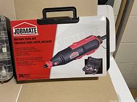 Jobmate rotary tool kit box front with product image and specifications, showing 36 pieces and red/black rotary tool design.