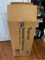 Box showing brand Imperial and labeled 'Insulated Flexible Duct','Conductor Flexible Aislado', packaging in cardboard box.