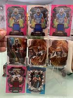 Image showing rookie gear patch cards for Quentin Johnston and Jamire Gibbs, prizmatic parallel cards, and a pink rookie gear patch card.