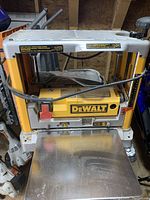 Front view of benchtop planer, tables down