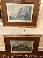 Framed print 'Returning From the Hunt' by W. Shayer, showing riders approaching a building on horseback, with dogs in front, sepia toned with matting and wooden frame