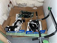 Shows Bauer Junior Supreme skates size 4, Bauer Performance skates size 6, Powder Ridge snowshoes and pull up bar in lot.
