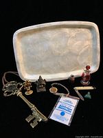 Full lot of 10 items arranged on black background with Capiz shell tray behind
