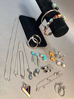 All pieces displayed including necklaces, earrings, bracelets and pendant