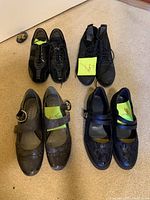 Top view showing all four pairs of ladies shoes, with lace-up and buckle styles.