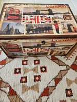 Top and front sides of the decorative trunk showing British London themed images