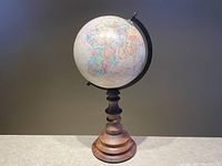 Front view of globe with pointed top visible and detailed map.