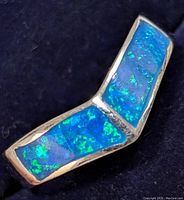 Close-up front view of silver ring with two rectangular blue opalite inlays forming a V shape.