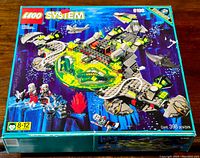 Front of sealed box showing set art, age range and part count