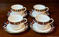 Set of four Royal Crown Derby 'Old Imari' fine bone china tea cups each paired with a saucer, showing overall lot contents