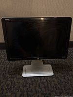 Front view of the HP w2207h monitor showing its screen and silver base stand.