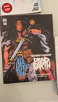 Cover of Wonder Woman Dead Earth showing Wonder Woman with sword and detailed comic style art