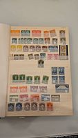 Album page showing mixed denominations of Canadian stamps in rows