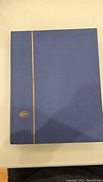 Blue hardcover album with gold detailing on spine