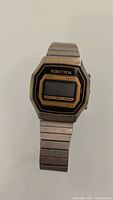 Front view of the Robotron digital watch showing the face and metal band.