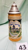 Full front view of the colorful vintage beer stein showing the University of Notre Dame scene and pewter lid.
