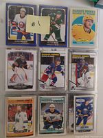 Photo of hockey cards page with 9 cards shown, including Adam Pelech, Victor Rask, and Marquee Rookies.