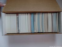 Top view of the white cardboard box holding the entire collection of hockey cards showing the tightly packed cards inside.