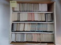 Photo of the open box showing hundreds of hockey cards organized in rows inside the cardboard box.