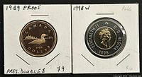 Two coins in protective cardboard holders; left is 1989 Canadian proof Loonie with a common loon on reverse, right is 1998 Canadian proof-like Twoonie with a polar bear on reverse.
