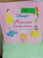 Front cover of the Disney's Princess Collection book showing several princess illustrations and the title.