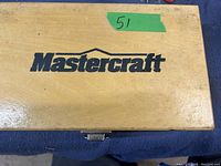 Wooden case with Mastercraft branding on top, showing the brand label