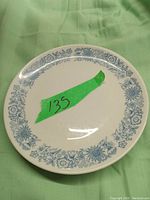 Single Royal Dalton white porcelain saucer with blue floral border pattern, lightly used condition.