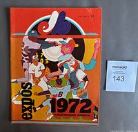 Front cover of the 1972 Montreal Expos official yearbook showing vibrant, colorful artwork of baseball players and the Expos logo.