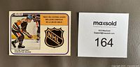 Front side of the card showing Wayne Gretzky in Edmonton Oilers uniform, NHL logo, and text indicating 1980-81 NHL scoring leader.