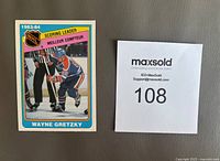 Front of the 1984-85 OPC Wayne Gretzky NHL Scoring Leader card showing image of Gretzky in uniform with title and season dates.