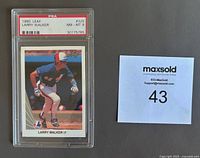 Front side of 1990 Leaf Larry Walker rookie card in a PSA slab with grade NM-MINT 8 visible.