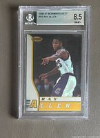 Front view of 1996-97 Bowman’s Best Ray Allen rookie card in Beckett 8.5 graded holder showing player image and card design.