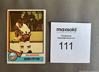 Front side of Denis Potvin rookie card showing him in New York Islanders hockey uniform with card number and team name.