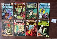Front covers of seven The House of Secrets comics, issues 100, 115 to 120, showing varying cover art with supernatural themes.