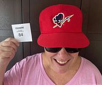 Front view of red Ottawa Rough Riders Starter baseball cap being worn, showing logo and fit.