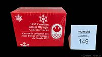 Sealed red box with white snowflake and Olympic logos reading '1992 Canadian Winter Olympic Collector Cards' with a Canadian maple leaf Olympic crest