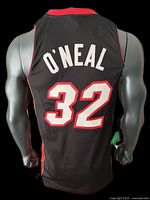 Back view showing stitched O'NEAL name and number 32 in white with red outline on black mesh fabric.