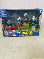 Front view of The Smurfs band set with 9 character figures and musical instruments in original packaging.