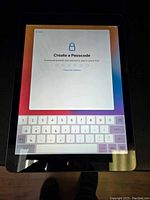 Front view displaying 'Create a Passcode' setup screen.