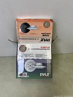 Closed box of Pyle dual cone waterproof stereo speaker system showing branding and model PLMR51W