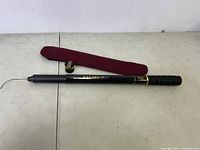 Full view of BAKAWA fishing rod, reel, and carrying case laid out flat on table