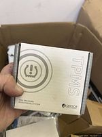 TPMS Tire Pressure Monitoring System box showing 4 sensor indication and branding