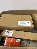 Top view of box showing several cardboard boxes with labels and barcodes, some labeled Made in China